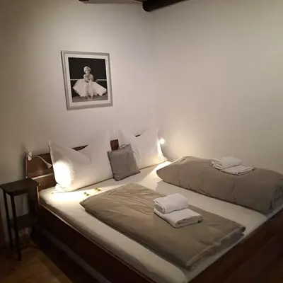 Ein Bett oder Betten in einem Zimmer der Unterkunft City Kitz