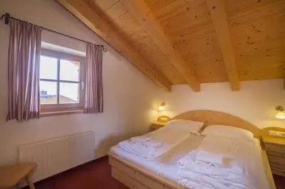 Ein Bett oder Betten in einem Zimmer der Unterkunft Schöneben Chalet Hohe Tauern Blick