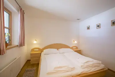 Ein Bett oder Betten in einem Zimmer der Unterkunft Schöneben Chalet Hohe Tauern Blick