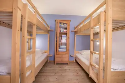 Ein Bett oder Betten in einem Zimmer der Unterkunft Schöneben Chalet Waldblick
