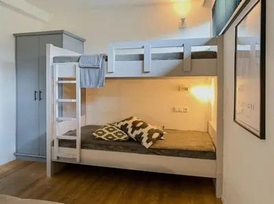 Ein Bett oder Betten in einem Zimmer der Unterkunft Schöneben Chalet Schneerose