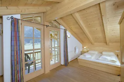 Ein Bett oder Betten in einem Zimmer der Unterkunft Schöneben Chalet 4-Jahreszeiten