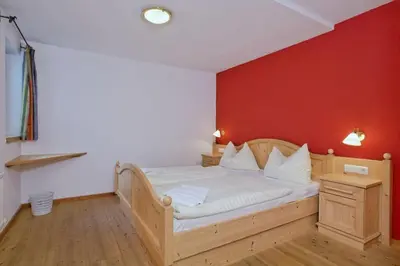 Ein Bett oder Betten in einem Zimmer der Unterkunft Schöneben Chalet 4-Jahreszeiten