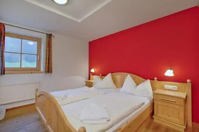 Ein Bett oder Betten in einem Zimmer der Unterkunft Schöneben Chalet 4-Jahreszeiten
