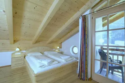 Ein Bett oder Betten in einem Zimmer der Unterkunft Schöneben Chalet 4-Jahreszeiten