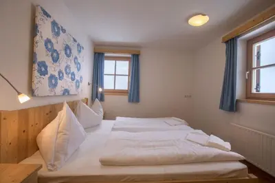 Ein Bett oder Betten in einem Zimmer der Unterkunft Schöneben Chalet Waldkrone