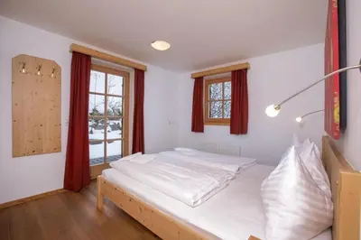 Ein Bett oder Betten in einem Zimmer der Unterkunft Schöneben Chalet Waldkrone
