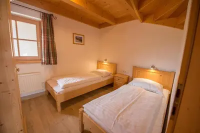 Ein Bett oder Betten in einem Zimmer der Unterkunft Schöneben Chalet Drei Sonnen