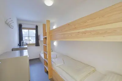 Ein Bett oder Betten in einem Zimmer der Unterkunft Schöneben Chalet Ferienwelt