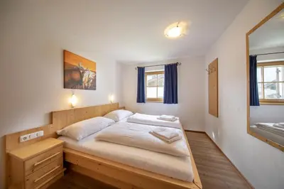 Ein Bett oder Betten in einem Zimmer der Unterkunft Schöneben Chalet Anton