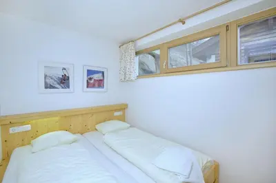 Ein Bett oder Betten in einem Zimmer der Unterkunft Schöneben Abben Hütte