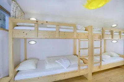 Ein Bett oder Betten in einem Zimmer der Unterkunft Schöneben Abben Hütte