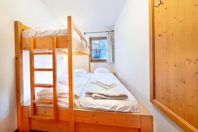 Ein Bett oder Betten in einem Zimmer der Unterkunft Schöneben Chalet Wiesenwald