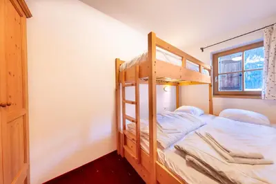Ein Bett oder Betten in einem Zimmer der Unterkunft Schöneben Chalet Wiesenwald