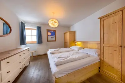 Ein Bett oder Betten in einem Zimmer der Unterkunft Schöneben Chalet zur Mühle
