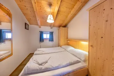 Ein Bett oder Betten in einem Zimmer der Unterkunft Schöneben Chalet zur Mühle