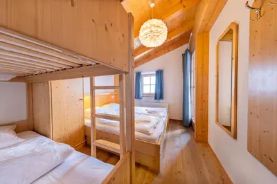 Ein Bett oder Betten in einem Zimmer der Unterkunft Schöneben Chalet zur Mühle