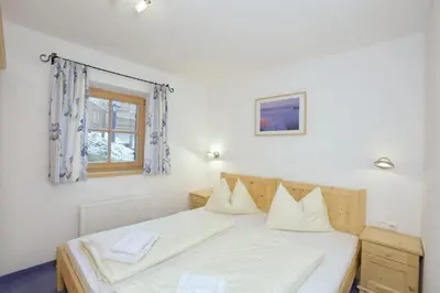 Ein Bett oder Betten in einem Zimmer der Unterkunft Schöneben Heidi's Alm Hütte