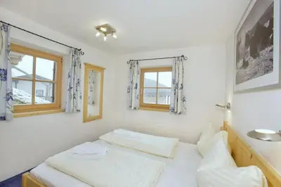 Ein Bett oder Betten in einem Zimmer der Unterkunft Schöneben Heidi's Alm Hütte