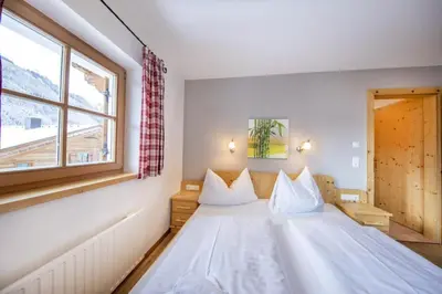 Ein Bett oder Betten in einem Zimmer der Unterkunft Schöneben Chalet MilKa