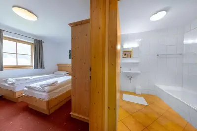 Ein Bett oder Betten in einem Zimmer der Unterkunft Schöneben Chalet Enzian