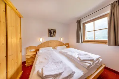 Ein Bett oder Betten in einem Zimmer der Unterkunft Schöneben Chalet Enzian
