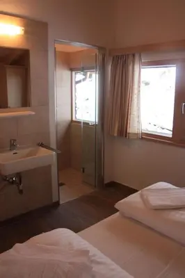 Ein Bett oder Betten in einem Zimmer der Unterkunft Schöneben Haus Silberdistel
