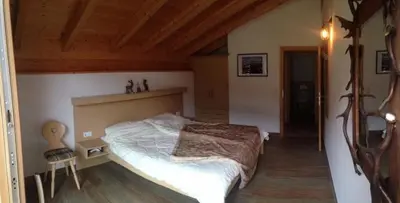 Ein Bett oder Betten in einem Zimmer der Unterkunft Schöneben Haus Silberdistel