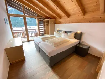Ein Bett oder Betten in einem Zimmer der Unterkunft Schöneben Haus Arnika