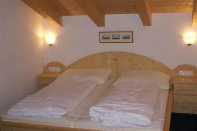 Ein Bett oder Betten in einem Zimmer der Unterkunft Schöneben Berghütte