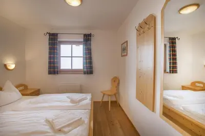 Ein Bett oder Betten in einem Zimmer der Unterkunft Schöneben Chalet Schöneck