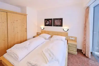 Ein Bett oder Betten in einem Zimmer der Unterkunft Schöneben Haus Wenters