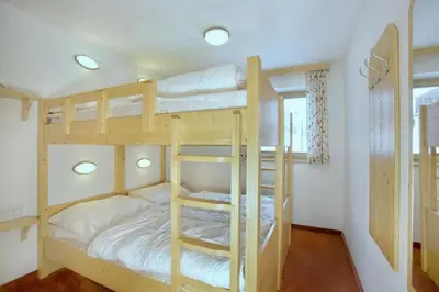 Ein Bett oder Betten in einem Zimmer der Unterkunft Schöneben Haus Sonneck