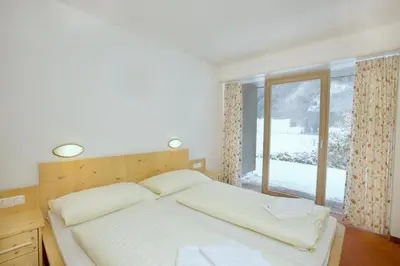 Ein Bett oder Betten in einem Zimmer der Unterkunft Schöneben Haus Sonneck