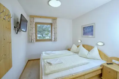 Ein Bett oder Betten in einem Zimmer der Unterkunft Schöneben Haus Wikinge