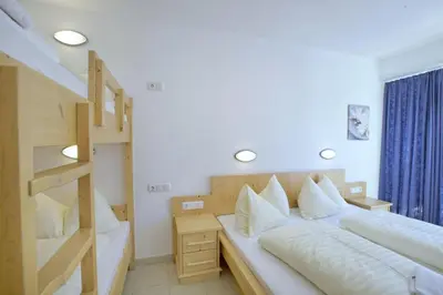 Ein Bett oder Betten in einem Zimmer der Unterkunft Schöneben Haus Gernkogel