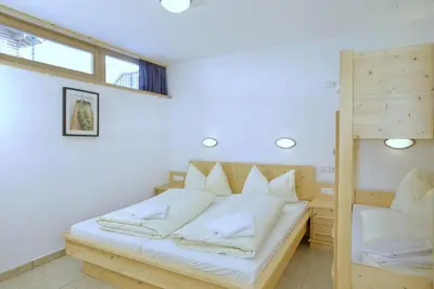 Ein Bett oder Betten in einem Zimmer der Unterkunft Schöneben Haus Gernkogel