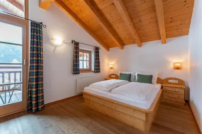 Ein Bett oder Betten in einem Zimmer der Unterkunft Schöneben Chalet Op 't Suyden