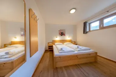 Ein Bett oder Betten in einem Zimmer der Unterkunft Schöneben Haus am Bad