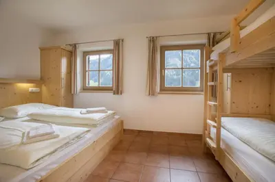 Ein Bett oder Betten in einem Zimmer der Unterkunft Schöneben Zwillinger Hütte
