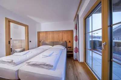 Ein Bett oder Betten in einem Zimmer der Unterkunft Nationalpark Chalet Grosser Hexenkopf