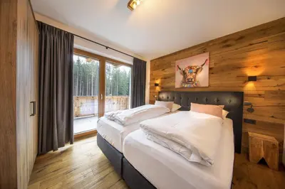 Ein Bett oder Betten in einem Zimmer der Unterkunft Nationalpark Chalet Kreuzkogel