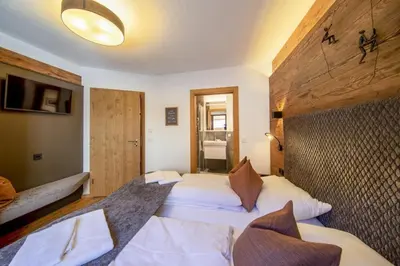Ein Bett oder Betten in einem Zimmer der Unterkunft Nationalpark Chalet Mittereggspitze