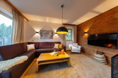 Ein Sitzbereich in der Unterkunft Nationalpark Chalet Quirl