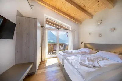 Ein Bett oder Betten in einem Zimmer der Unterkunft Nationalpark Chalet Pillewizer