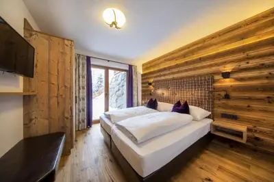 Ein Bett oder Betten in einem Zimmer der Unterkunft Nationalpark Chalet Schneespitze