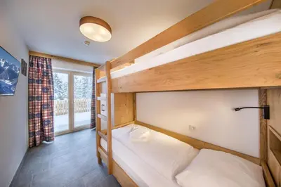 Ein Bett oder Betten in einem Zimmer der Unterkunft Nationalpark Chalet Hohes Aderl