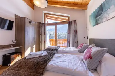 Ein Bett oder Betten in einem Zimmer der Unterkunft Nationalpark Chalet Goldbergspitze