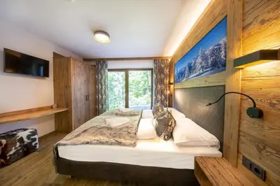 Ein Bett oder Betten in einem Zimmer der Unterkunft Nationalpark Chalet Reichenbergerspitze