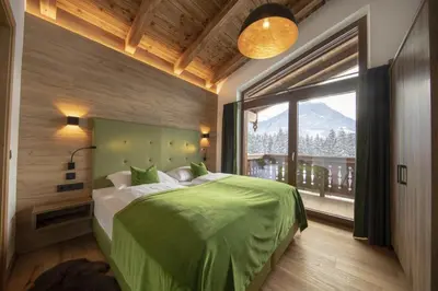 Ein Bett oder Betten in einem Zimmer der Unterkunft Nationalpark Chalet Dreiherrenspitze